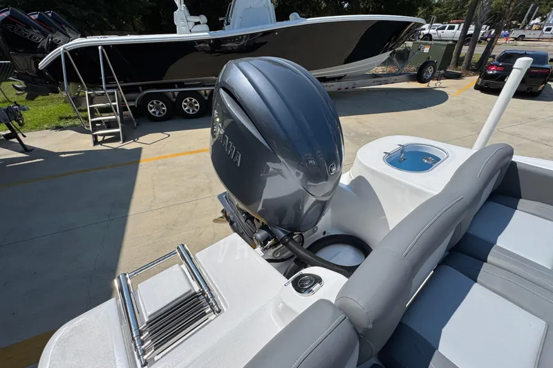 Slide: The Image of 2026 NauticStar 212 Legacy boat with Yamaha outboard motor, docked on a sunny day. - 35