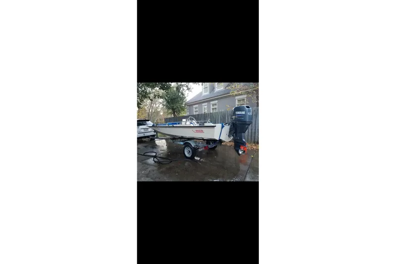 Slide: The Image of 1991 Boston Whaler 15 GLS boat on trailer with Yamaha outboard motor. - 3