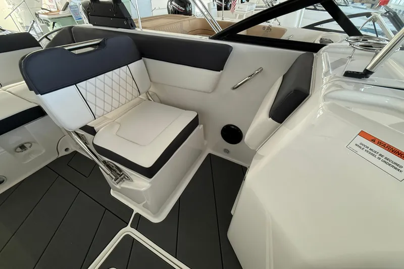 Slide: The Image of 2026 Bayliner D22 boat interior with modern seating and sleek design. - 10