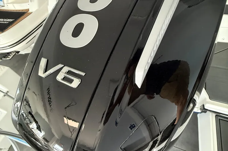 Slide: The Image of 2026 Bayliner D22 V6 engine cover, sleek black design with silver lettering. - 16