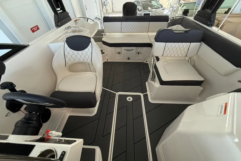 Slide: The Image of 2026 Bayliner D22 boat interior with modern seating and sleek design. - 8