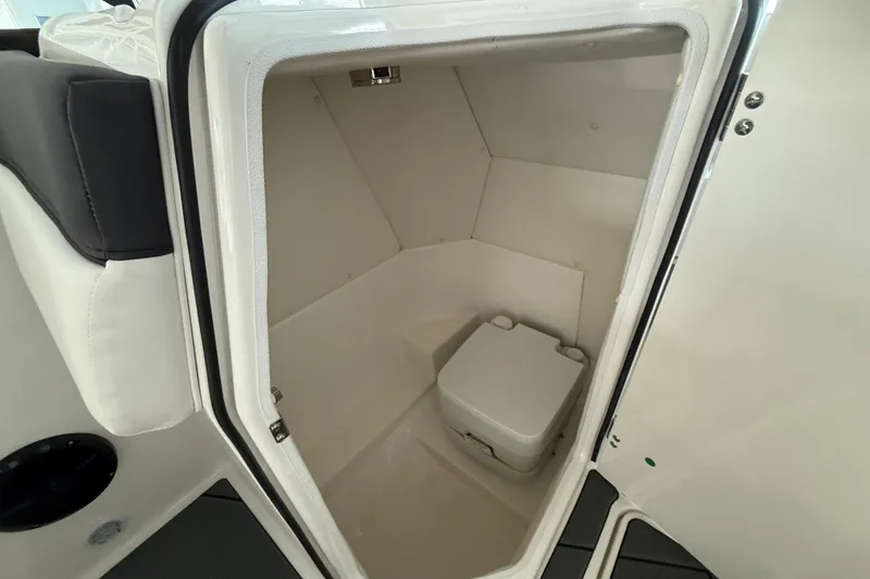 Slide: The Image of 2026 Bayliner D22 boat interior with compact marine toilet. - 9