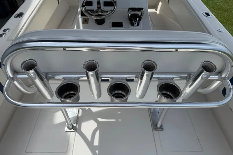Slide: The Image of 2008 Contender 31 Cuddy boat with stainless steel rod holders on deck. - 14