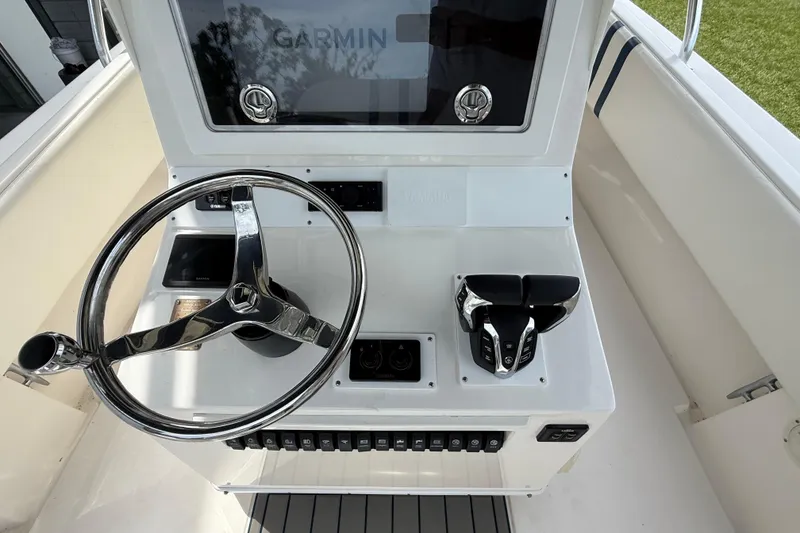 Slide: The Image of 2008 Contender 31 Cuddy helm with Garmin display and steering wheel. - 15