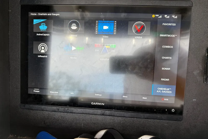 Slide: The Image of Garmin marine display on 2008 Contender 31 Cuddy, showing navigation and control options. - 16