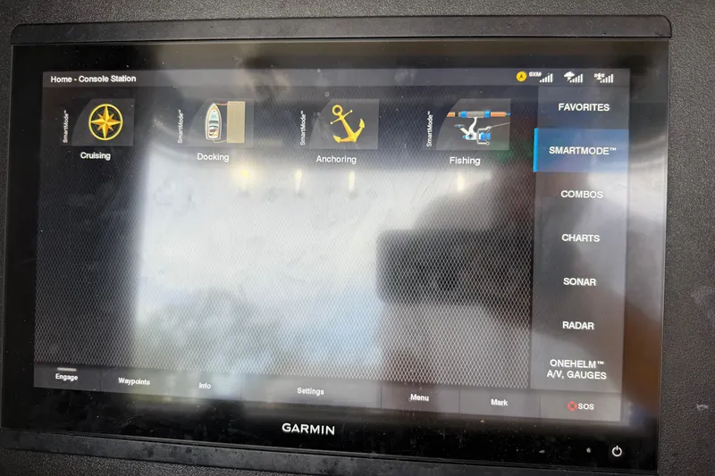 Slide: The Image of Garmin marine display on 2008 Contender 31 Cuddy, showing navigation and fishing modes. - 18