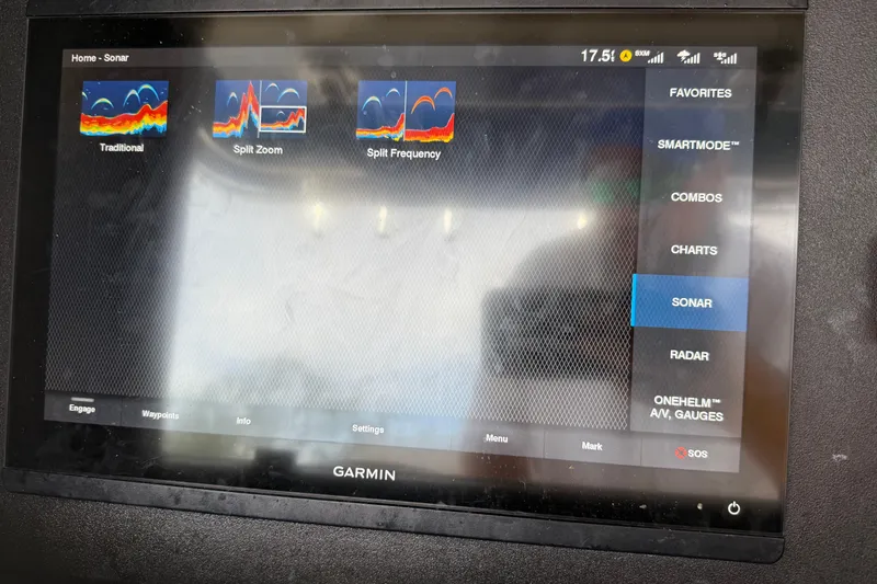 Slide: The Image of Garmin sonar display on 2008 Contender 31 Cuddy boat, showing various sonar modes. - 19