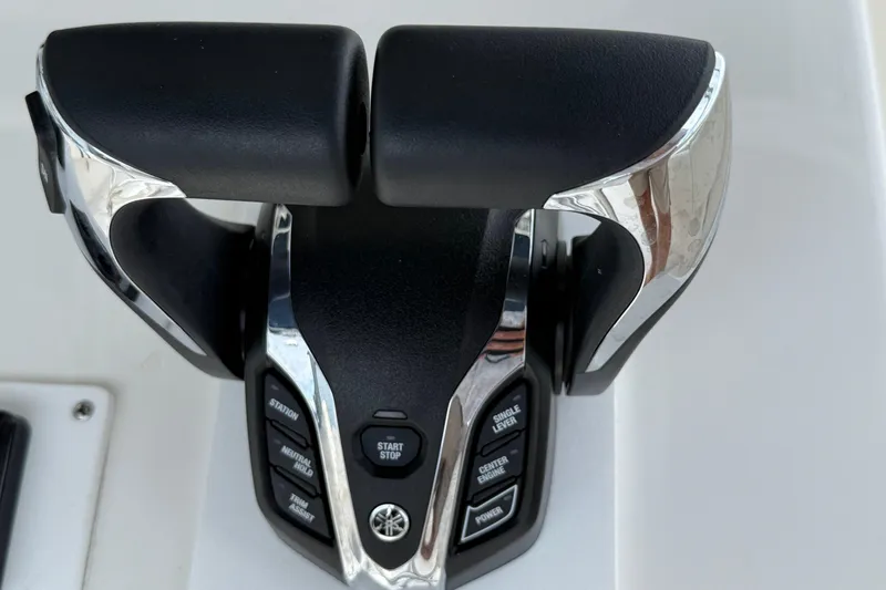 Slide: The Image of Throttle controls on a 2008 Contender 31 Cuddy boat, featuring Yamaha engine buttons. - 20