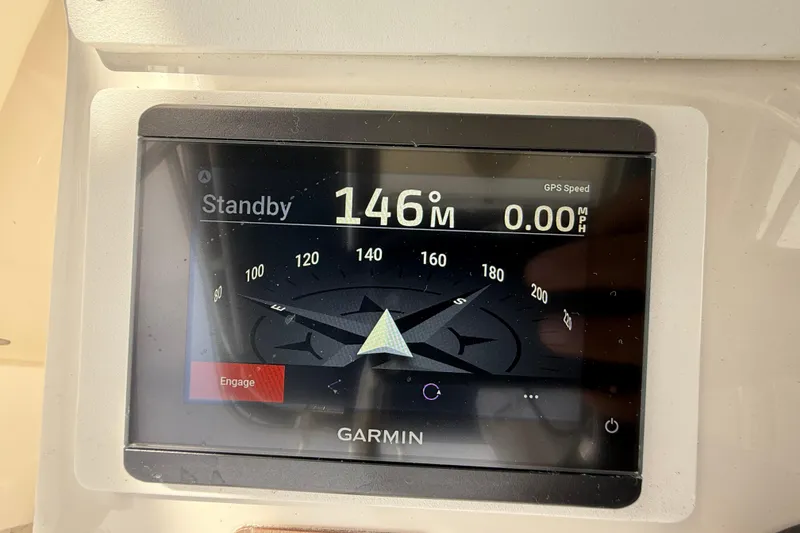 Slide: The Image of Garmin navigation display on 2008 Contender 31 Cuddy, showing standby mode and compass heading. - 21