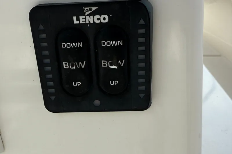 Slide: The Image of Lenco trim tab control panel on 2008 Contender 31 Cuddy boat. - 23