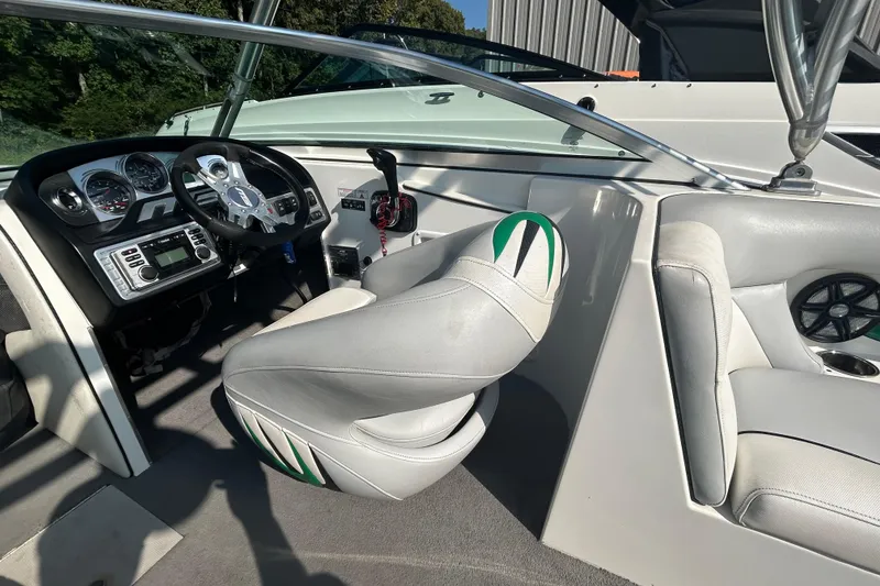 Slide: The Image of Interior of 2011 MB F21 Tomcat boat with steering wheel and dashboard controls. - 7