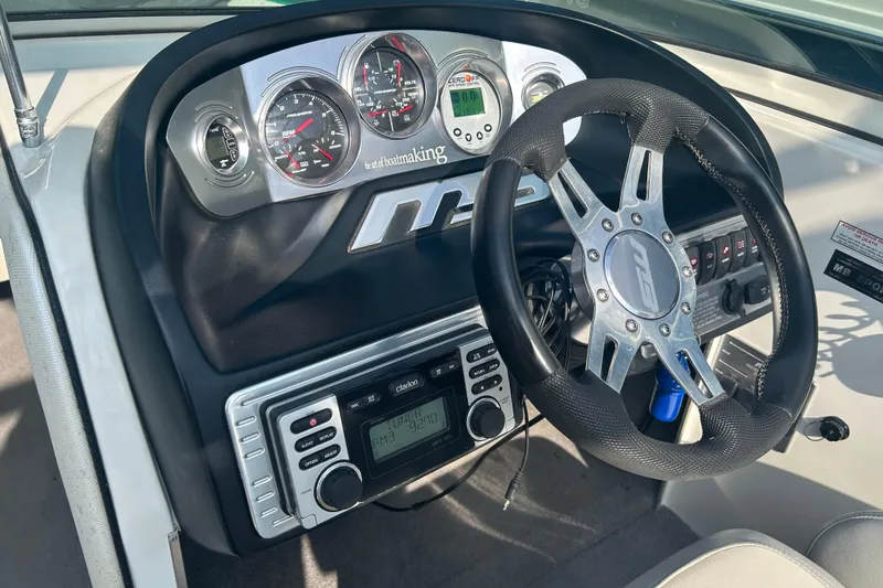 Slide: The Image of 2011 MB F21 Tomcat dashboard with steering wheel and control panel. - 8