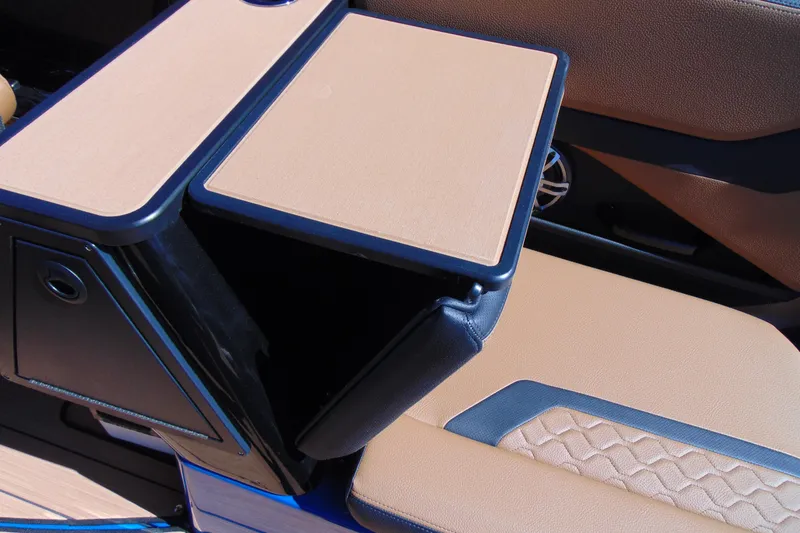 Slide: The Image of 2026 Yamaha Boats 255XD interior detail with tan upholstery and sleek design. - 12