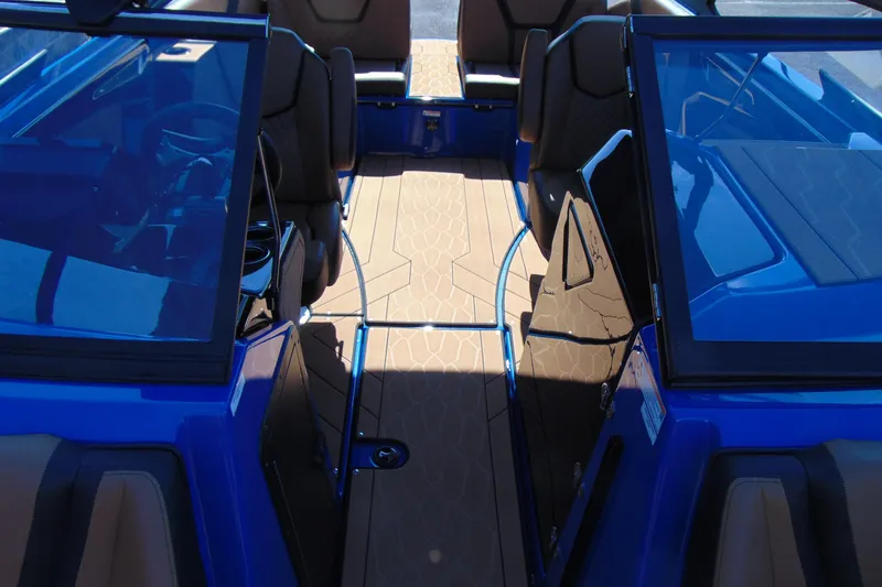 Slide: The Image of Interior view of 2026 Yamaha Boats 255XD, featuring sleek blue design and comfortable seating. - 15