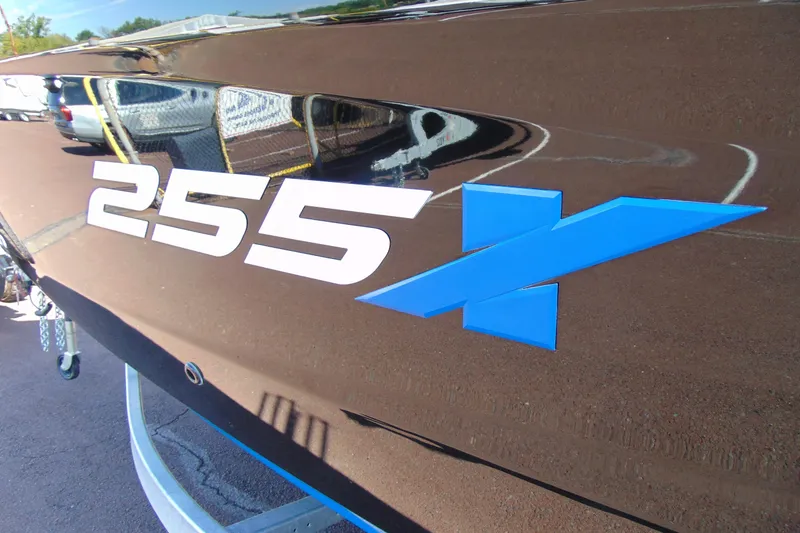 Slide: The Image of 2026 Yamaha Boats 255XD logo on sleek, reflective surface. - 4