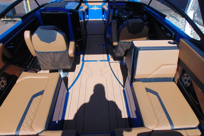 Slide: The Image of 2026 Yamaha Boats 255XD interior with tan seating and modern design. - 7