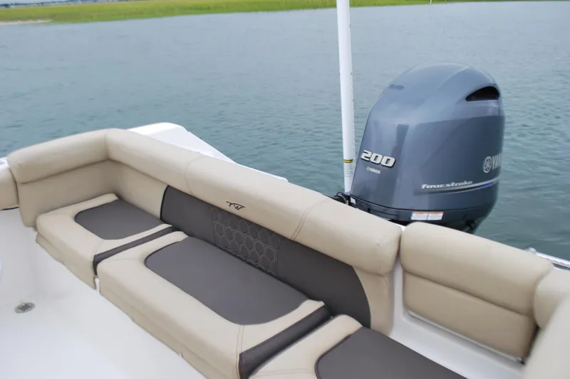 Slide: The Image of 2020 Tidewater 220 LXF boat with Yamaha 200 engine, featuring comfortable seating. - 16