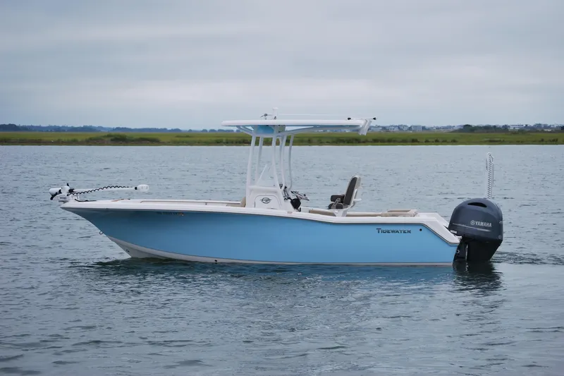 Slide: The Image of 2020 Tidewater 220 LXF boat on calm water with Yamaha outboard motor. - 3