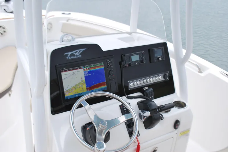 Slide: The Image of 2020 Tidewater 220 LXF boat dashboard with navigation and control systems. - 8