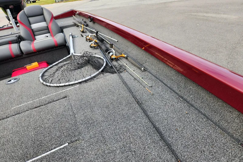 Slide: The Image of 2019 Ranger RT188C boat deck with fishing rods and net. - 12