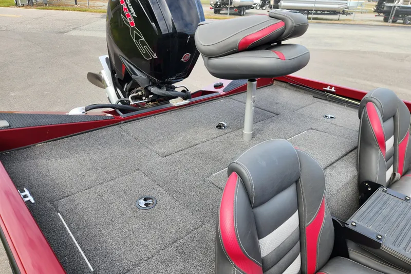 Slide: The Image of 2019 Ranger RT188C boat interior with gray and red seating, featuring a powerful outboard motor. - 17