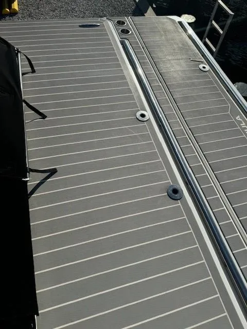 Slide: The Image of 2020 Formula 380 Super Sport Crossover I/O boat deck with sleek gray design. - 12