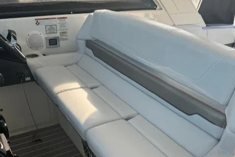 Slide: The Image of 2020 Formula 380 Super Sport Crossover I/O interior seating area with white upholstery. - 24