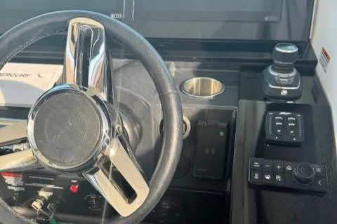 Slide: The Image of Steering wheel and controls of 2020 Formula 380 Super Sport Crossover I/O boat. - 30