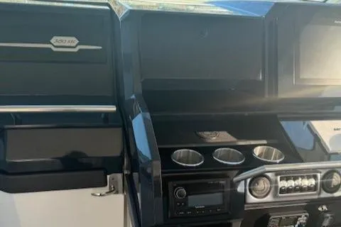 Slide: The Image of 2020 Formula 380 Super Sport Crossover I/O dashboard with cup holders and control panel. - 33