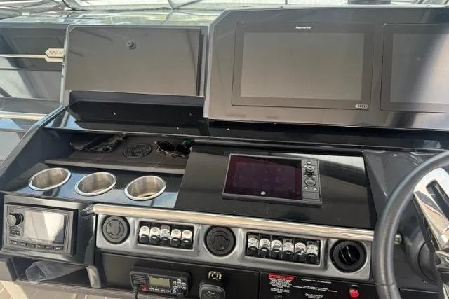 Slide: The Image of 2020 Formula 380 Super Sport Crossover I/O dashboard with modern navigation and control systems. - 34