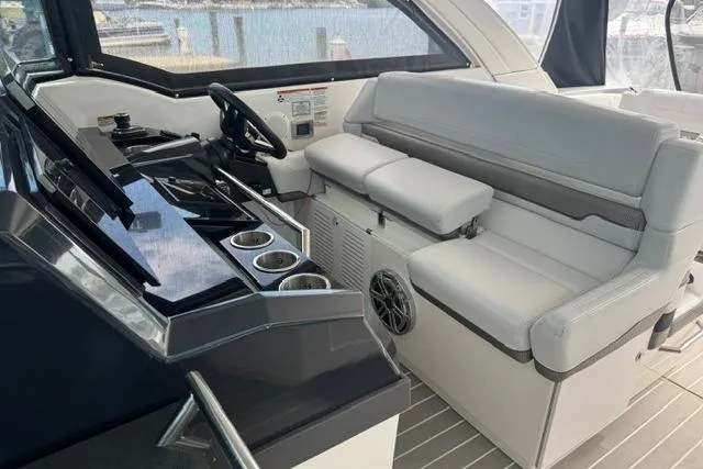 Slide: The Image of 2020 Formula 380 Super Sport Crossover I/O interior with sleek helm and comfortable seating. - 35