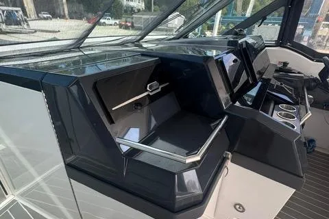 Slide: The Image of 2020 Formula 380 Super Sport Crossover I/O helm with modern controls and sleek design. - 36