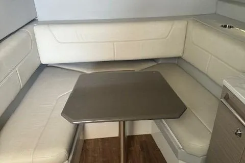 Slide: The Image of 2020 Formula 380 Super Sport Crossover I/O interior with beige seating and table. - 39