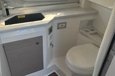 Slide: The Image of 2020 Formula 380 Super Sport Crossover I/O bathroom with sink and toilet. - 44