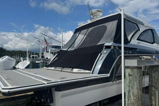 Slide: The Image of 2020 Formula 380 Super Sport Crossover I/O docked at marina, rear view. - 5