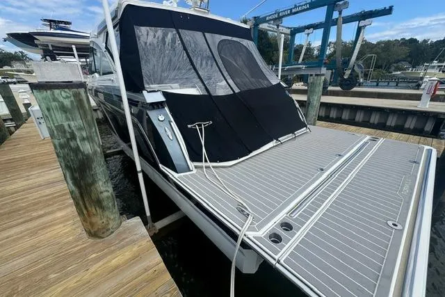 Slide: The Image of 2020 Formula 380 Super Sport Crossover I/O docked at a marina. - 6