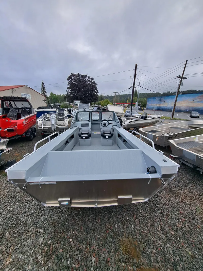 Slide: The Image of 2025 Klamath 19 GTX boat displayed outdoors on gravel lot. - 5