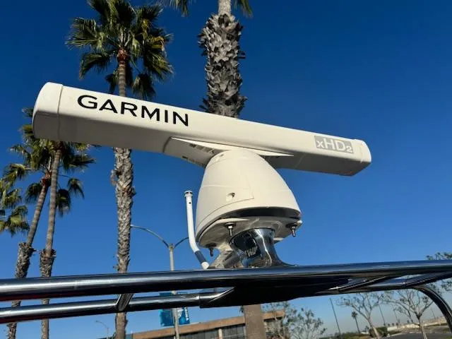 Slide: The Image of Garmin xHD2 radar on 2022 Allmand 31 RIB boat, clear blue sky background. - 3