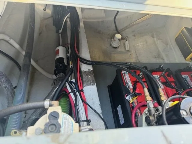 Slide: The Image of 2022 Allmand 31 RIB boat engine compartment with batteries and wiring. - 4