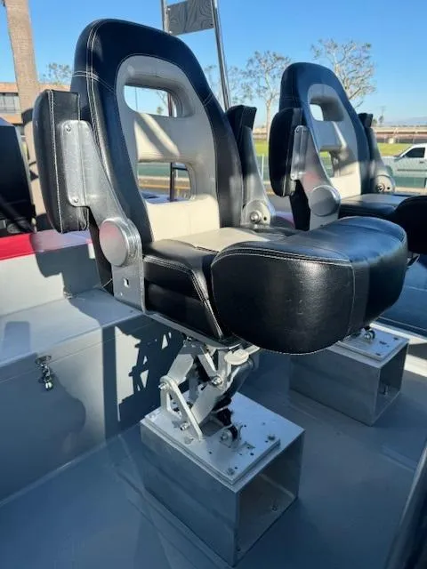 Slide: The Image of 2022 Allmand 31 RIB boat seats with black and silver design. - 5