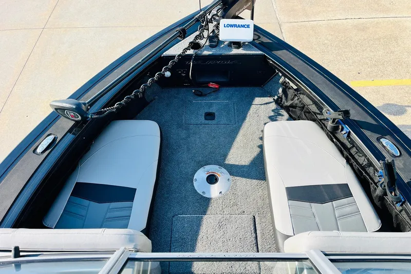 Slide: The Image of 2018 Tracker Targa V-19 Combo boat interior with seating and fishing equipment. - 10