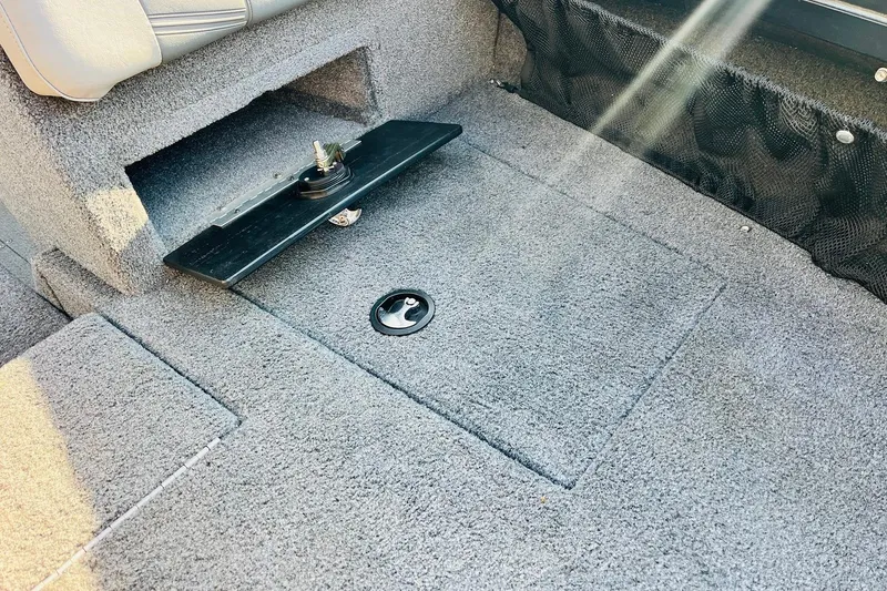 Slide: The Image of 2018 Tracker Targa V-19 Combo boat interior with carpeted storage compartment. - 20