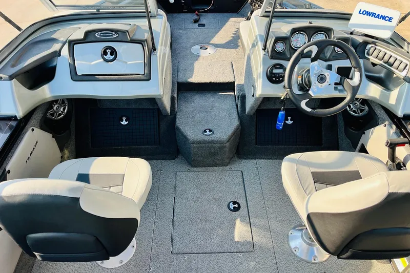 Slide: The Image of 2018 Tracker Targa V-19 Combo boat interior with steering wheel and seating. - 25