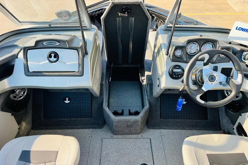 Slide: The Image of 2018 Tracker Targa V-19 Combo boat interior with steering wheel and dashboard controls. - 26