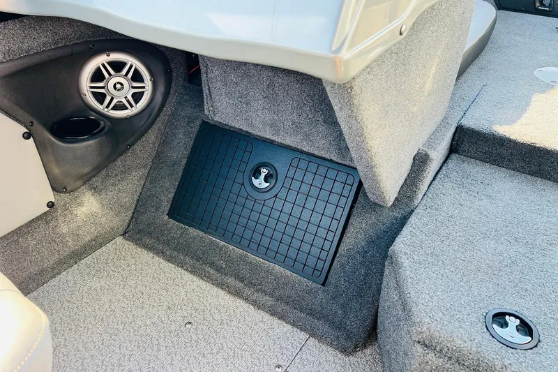 Slide: The Image of 2018 Tracker Targa V-19 Combo interior with speaker and storage compartment. - 29