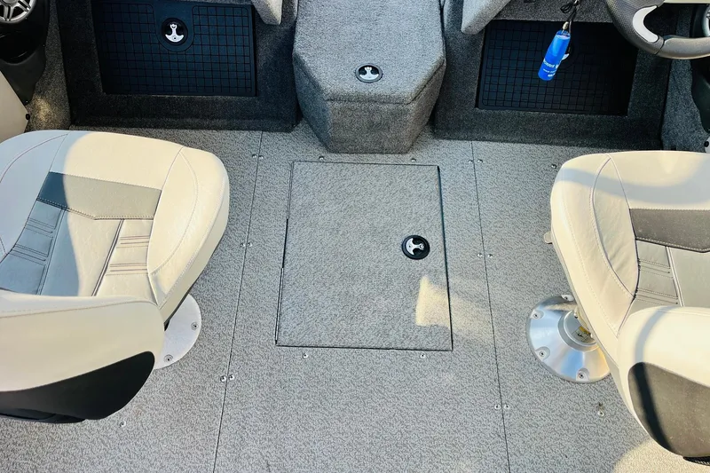 Slide: The Image of Interior of 2018 Tracker Targa V-19 Combo boat with two seats and carpeted floor. - 31