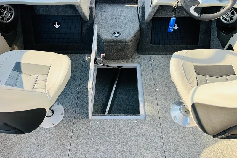 Slide: The Image of 2018 Tracker Targa V-19 Combo boat interior with open storage compartment and seating. - 32