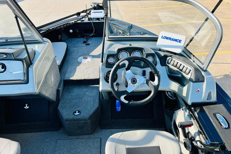 Slide: The Image of 2018 Tracker Targa V-19 Combo boat interior with steering wheel and Lowrance system. - 33