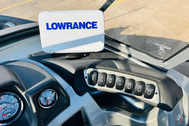 Slide: The Image of Dashboard of 2018 Tracker Targa V-19 Combo with Lowrance device and control switches. - 34