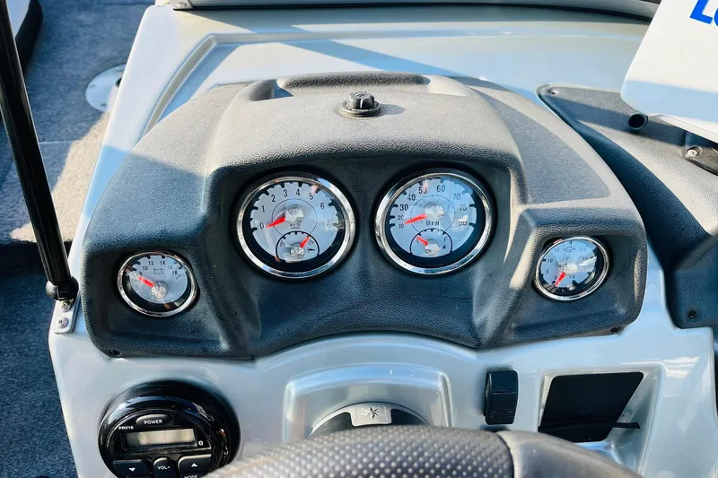 Slide: The Image of Dashboard of 2018 Tracker Targa V-19 Combo boat with gauges and controls. - 35